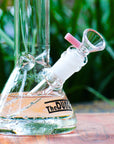 The Dung cool touch milky pink cone piece in a The Dung chronical bong in a garden