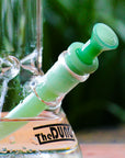 The Dung aqua half bowl cone piece in a The Dung chronical bong in a garden