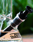The Dung black half bowl cone piece in a The Dung chronical bong