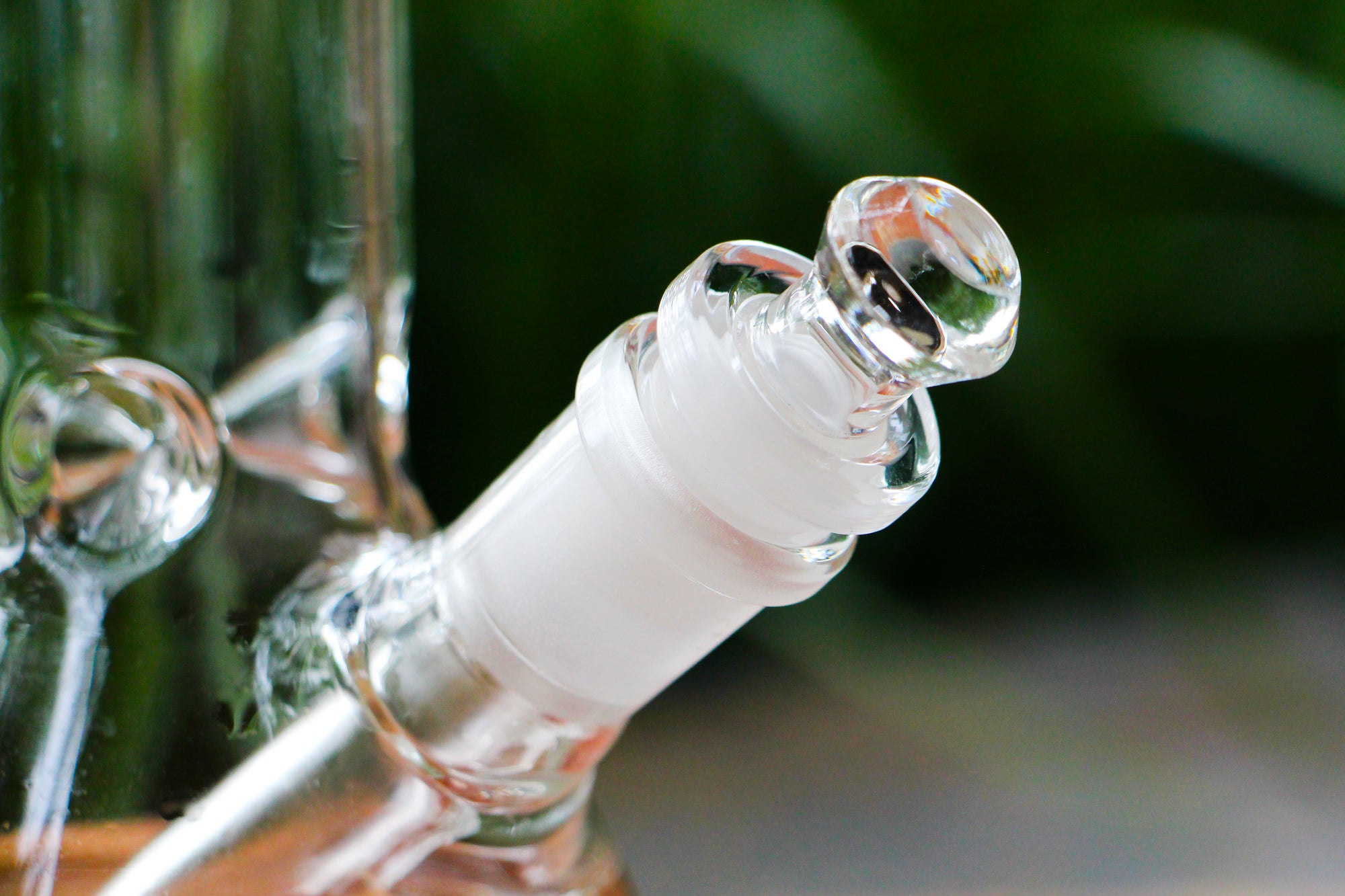 The Dung 14mm cleaning plug in a The Dung chronical bong in a garden