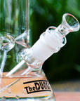 The Dung clear cone piece in a The Dung chronical bong in a garden