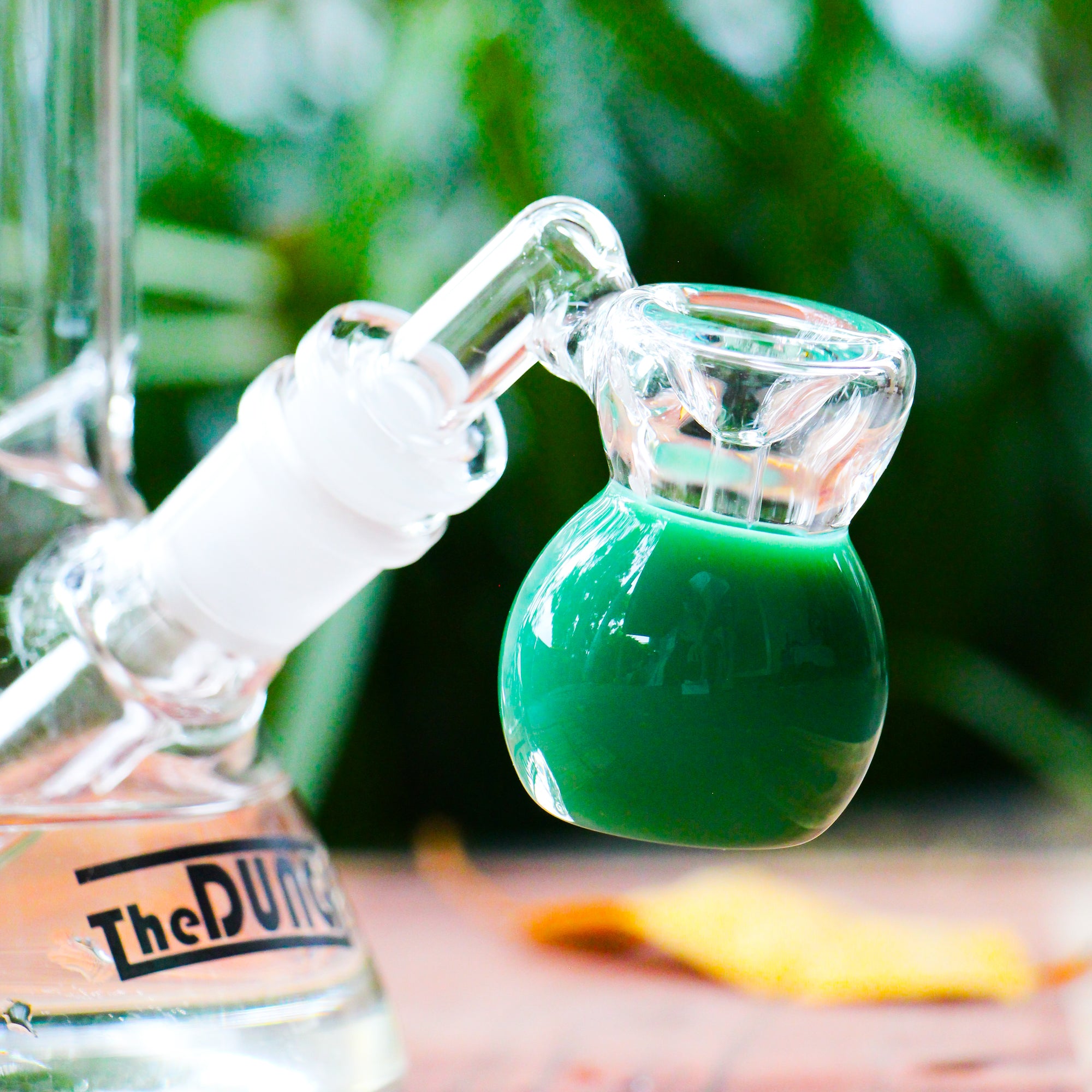 the dung 14mm jade mini perc ash catcher in a chronical bong in a garden