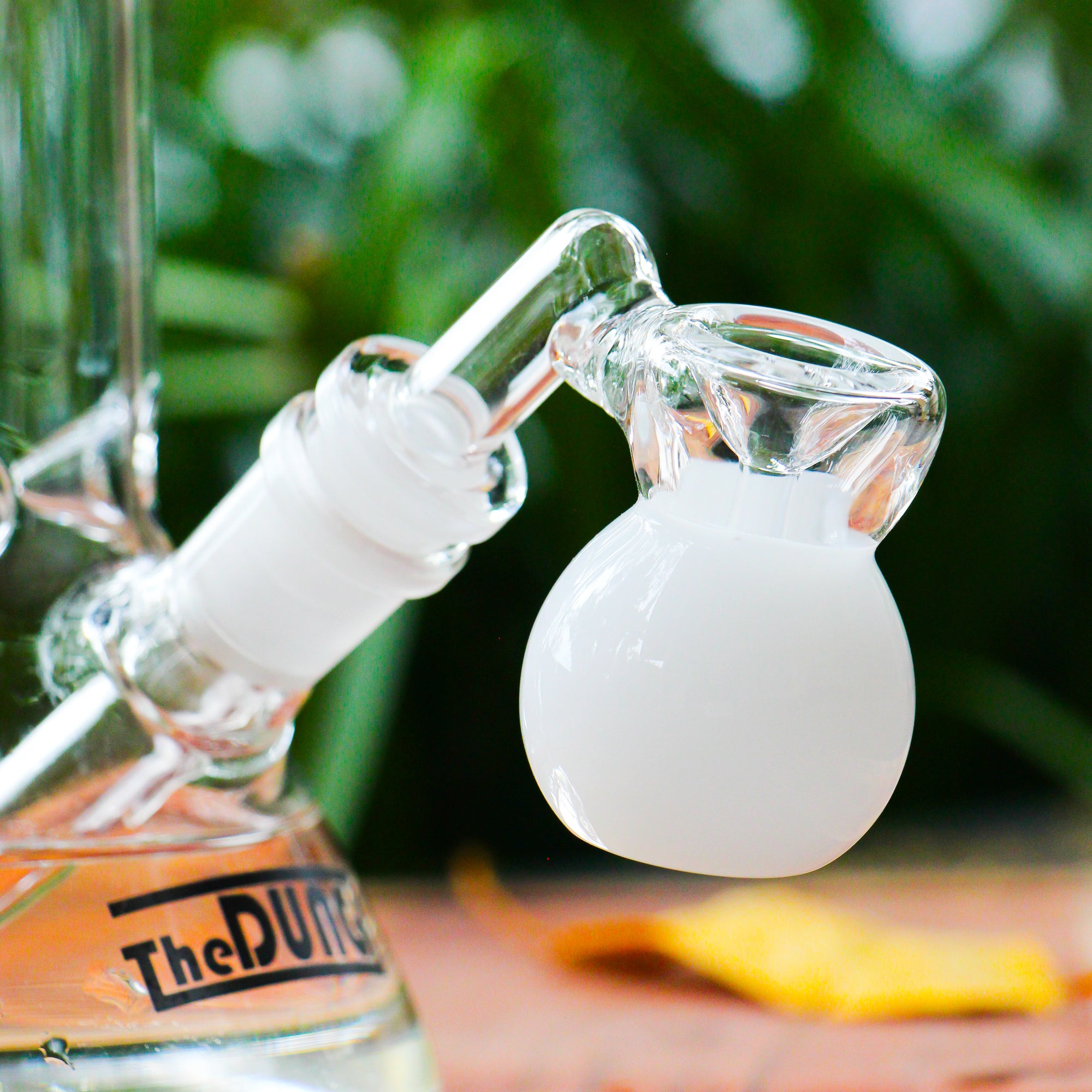 the dung 14mm white mini perc ash catcher in a chronical bong in a garden